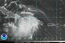 Tropical Storm Fay spun toward Cuba on Sunday after lashing Haiti and the Dominican Republic 